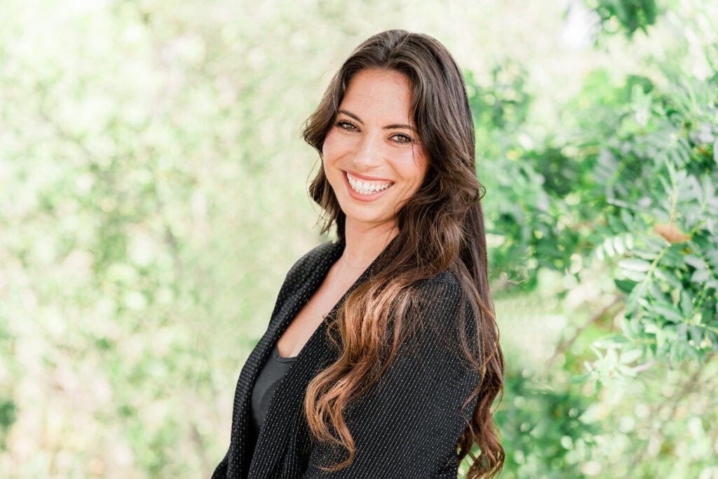 Healthy woman smiling outdoors at Del Rae Behavioral Health.